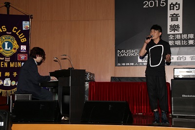 Visually impaired pianist Mr Lee Sing (left) played piano accompaniment for Mr Ryan Lau (right) in his singing performance